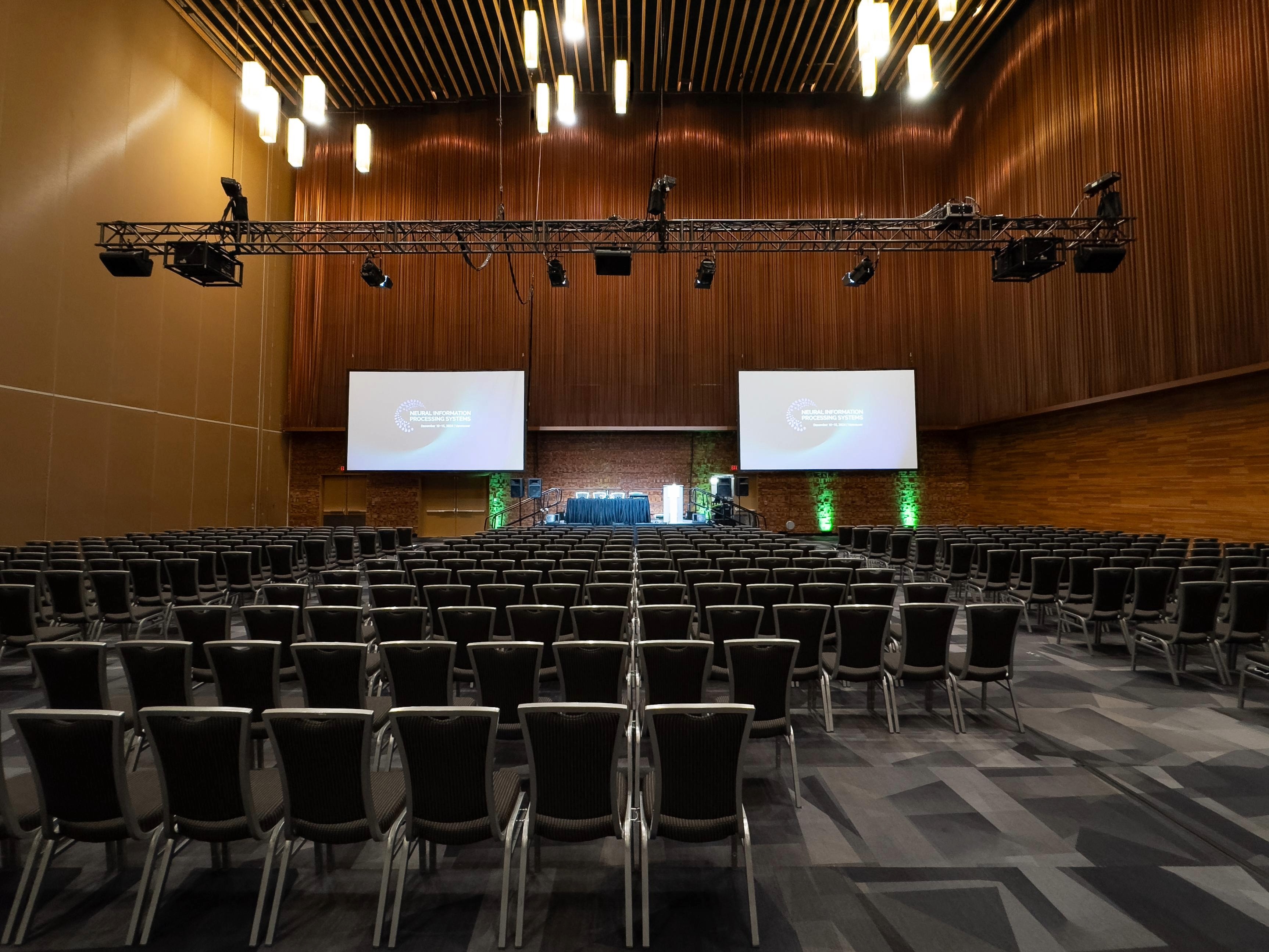 AV production setup for a corporate conference in a Vancouver hotel venue with screens and stage
