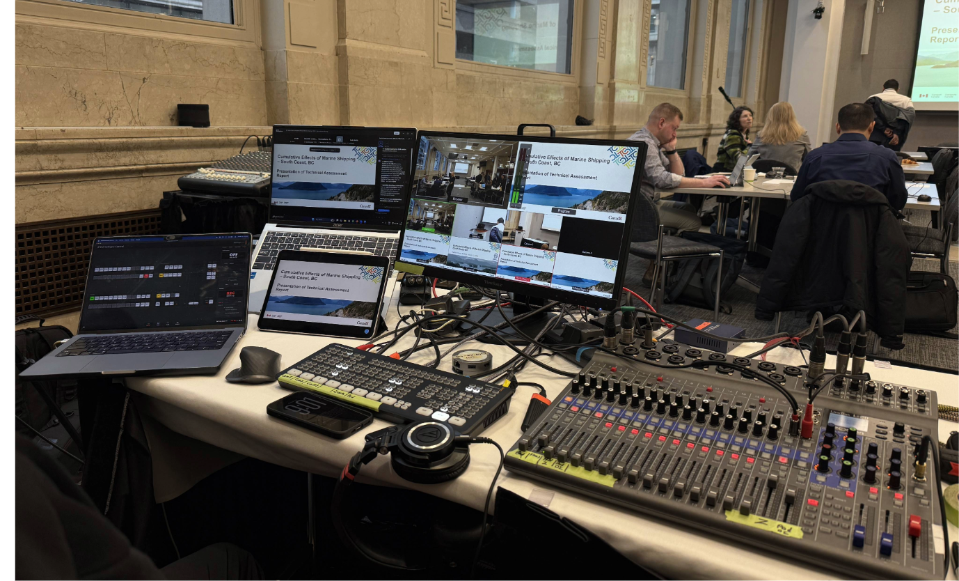 Hybrid event tech table with audio and platform monitoring in downtown Vancouver